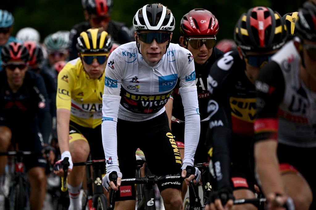 Team UAE Emirates Tadej Pogacar of Slovenia wearing the overall leaders yellow jersey L and Team Jumbo Vismas Jonas Vingegaard of Denmark wearing the best youngs white jersey ride in the pack during the 16th stage of the 108th edition of the Tour de France cycling race 169 km between Pas De La Case and SaintGaudens on July 13 2021 Photo by AnneChristine POUJOULAT AFP Photo by ANNECHRISTINE POUJOULATAFP via Getty Images