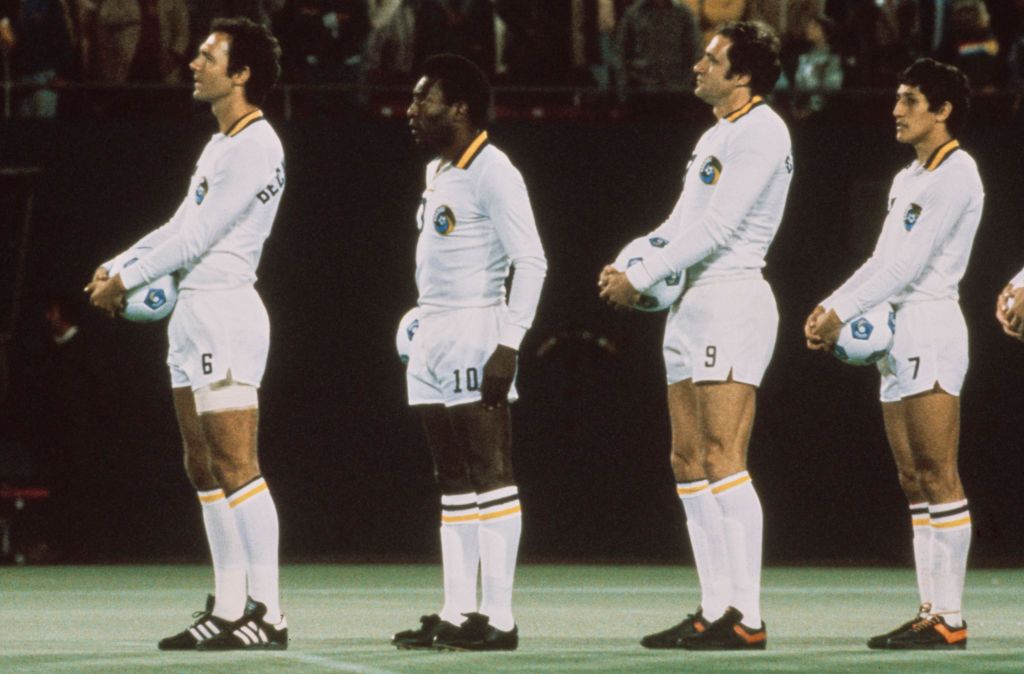 German footballer Franz Beckenbauer, Brazilian former professional footballer Pele, Italian footballer Giorgio Chinaglia (1947-2012), Paraguayan footballer Romerito line up for New York Cosmos, match, circa 1980. A central defender, Beckenbauer is acknowledged as having popularised the role of the sweeper in the modern game. (Photo by Bongarts/Getty Images) Amazon Prime Day