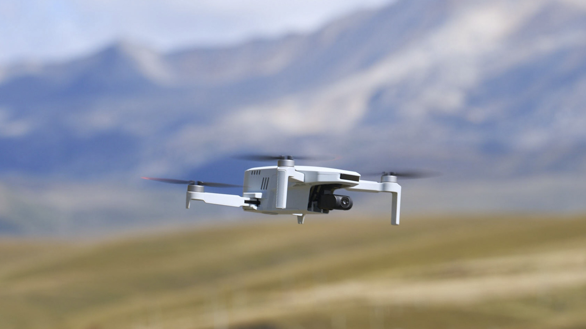 Potensic Atom 2 drone in flight with mountainous backdrop