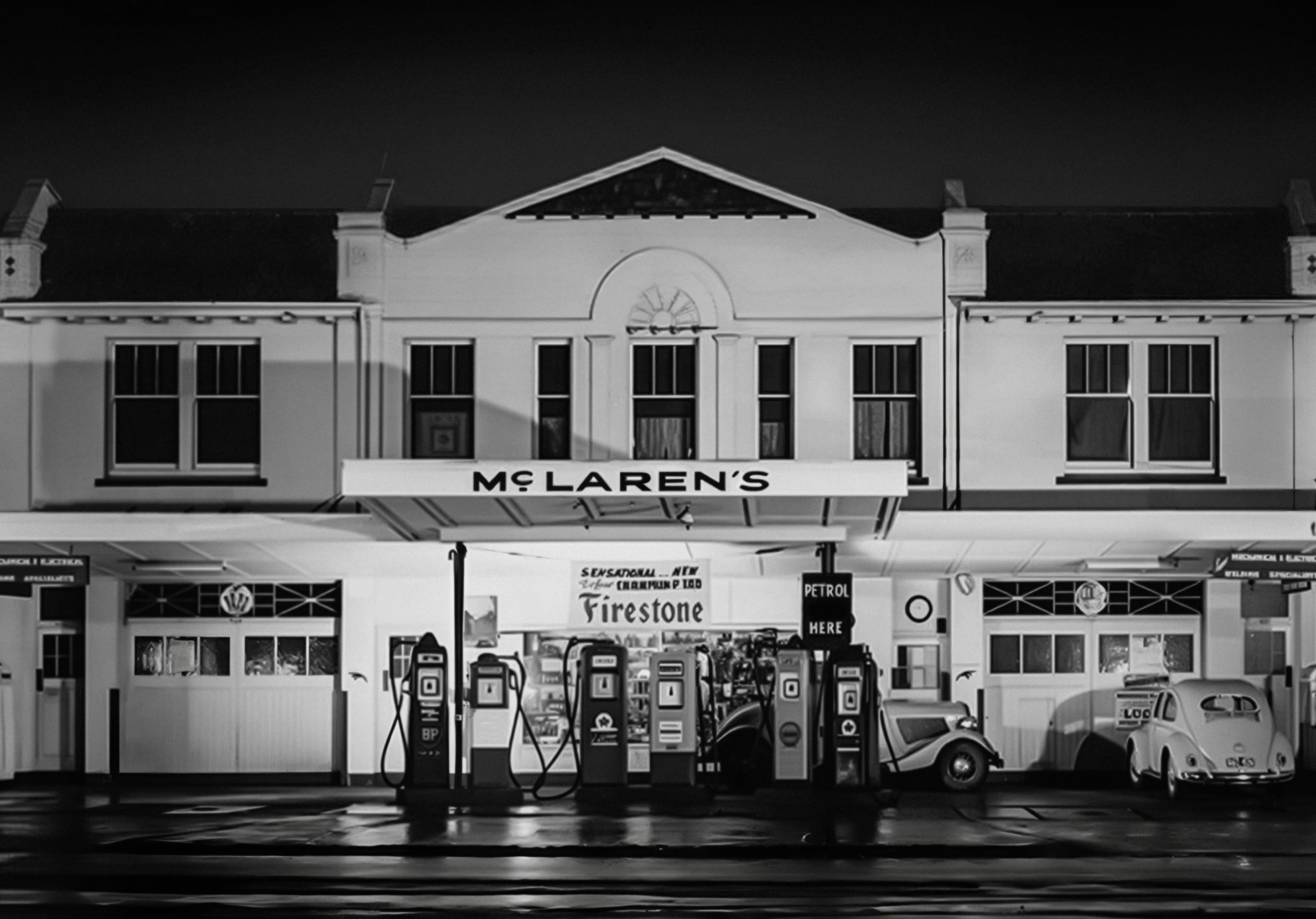 A black and white image of a garage, with the branding 'McLaren's'