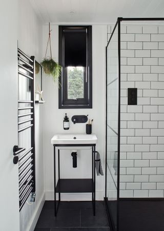 shower room with black and white fittings