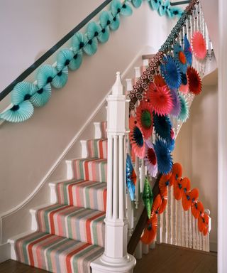 Staircase decorated in colorful paper decorations