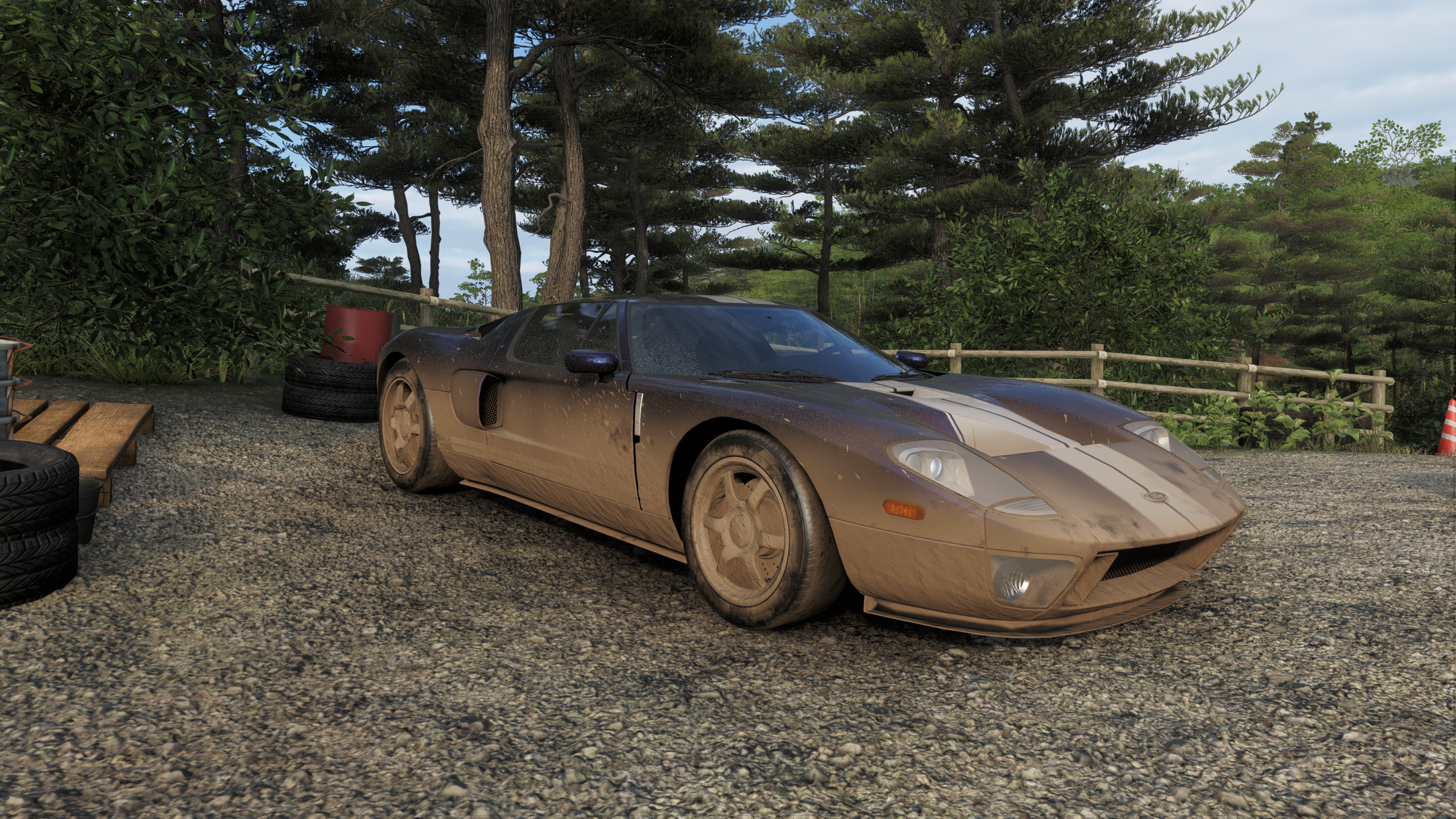 An in-game photo from Forza Horizon 6 showing the Ford GT Treasure Car as it's found, complete with dirt