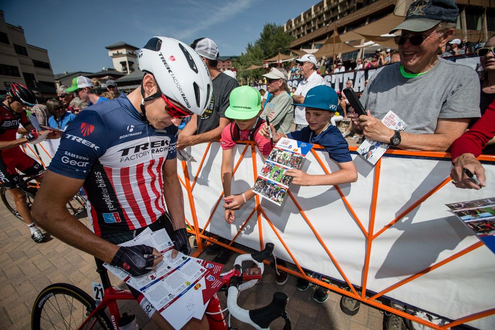 Matthew Busche (Trek) signs autographs for young fans at the start of USA Pro Challenge stage 2.