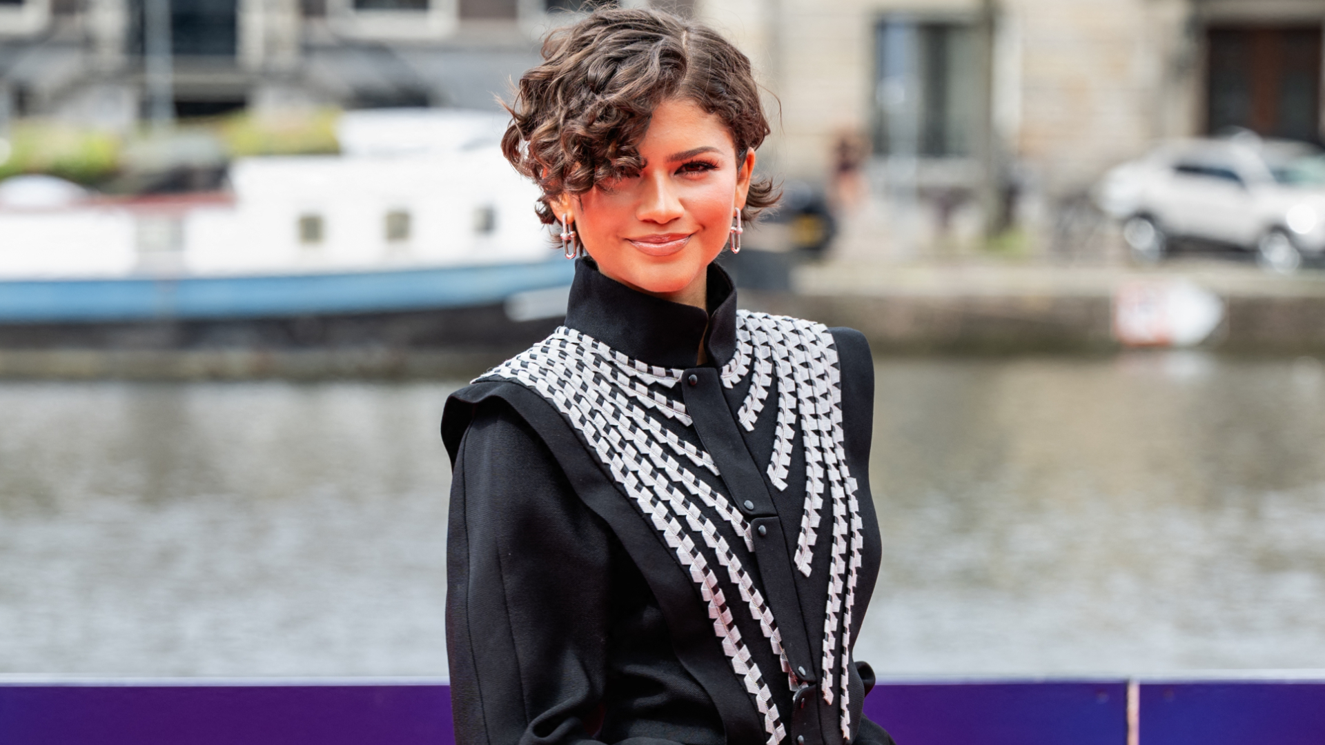 Zendaya attended the Amsterdam premiere of 'Spider-Man: Brand New Day' in a Louis Vuitton tailcoat and a strawberry red skirt