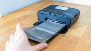 Canon SELPHY CP1300 Wireless Compact Photo Printer being tested in writer's home