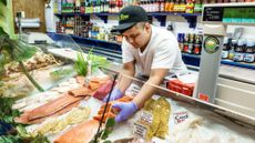 A fishmonger is seen at a store in Delray Beach, Florida.