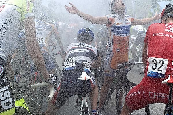 Ahhh, how good is this? A Letua Cycling team rider feels the refreshing cool water on his body while others simply soak it up after the finish to stage three in Mersing.