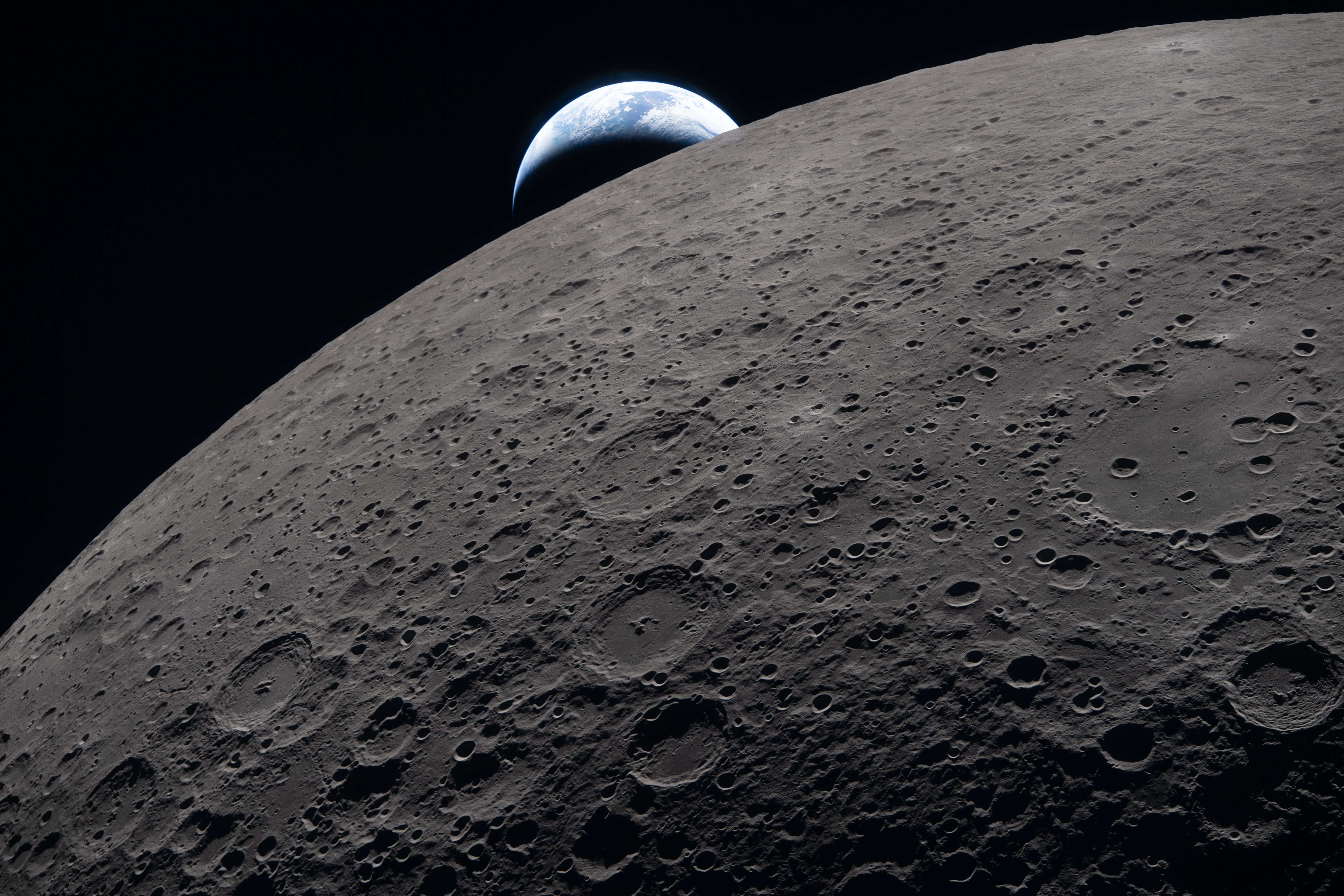 A photograph of the moon and Earth taken from Artemis II