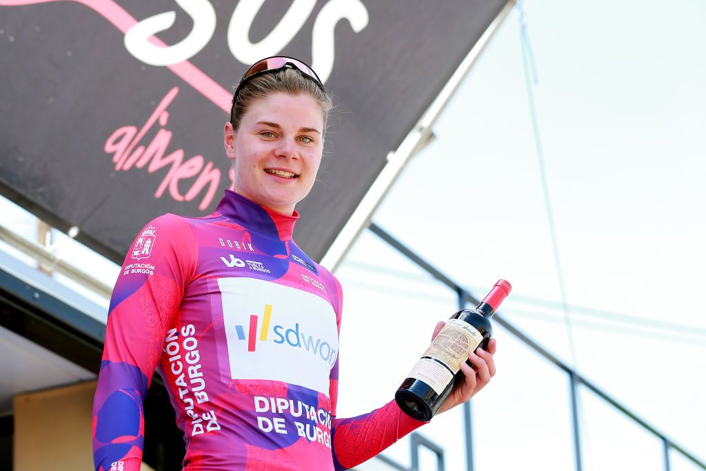 ARANDA DE DUERO SPAIN MAY 19 Lotte Kopecky of Belgium and Team SD Worx celebrates winning the pink leader jersey on the podium ceremony after the 7th Vuelta a Burgos Feminas 2022 Stage 1 a 1219km stage from Pedrosa del Prncipe to Aranda de Duero VueltaBurgos BurgosFem on May 19 2022 in Aranda de Duero Spain Photo by Gonzalo Arroyo MorenoGetty Images