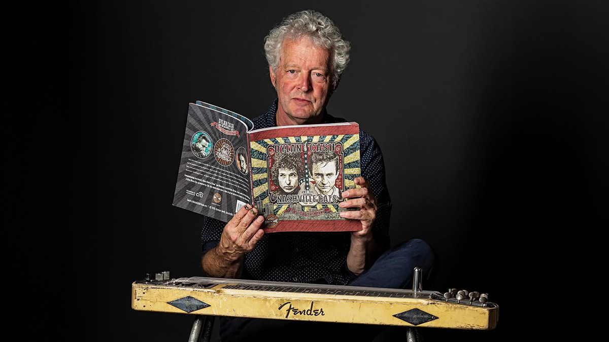 Pete Finney holding a magazine and Fender steel guitar
