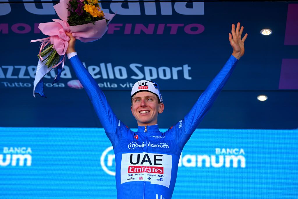 DESENZANO DEL GARDA ITALY MAY 18 Tadej Pogacar of Slovenia and UAE Team Emirates celebrates at podium as Blue Mountain Jersey winner during the 107th Giro dItalia 2024 Stage 14 a 312km individual time trial stage from Castiglione delle Stiviere to Desenzano del Garda UCIWT on May 18 2024 in Desenzano del Garda Italy Photo by Dario BelingheriGetty Images