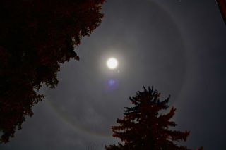 Jupiter shines bright near a halo-wrapped moon in this amazing photo by stargazer Hunter Davis of Durango, Colo., on Dec. 25, 2012.
