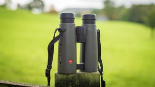 Leica Noctivid 10x42 on a fence post
