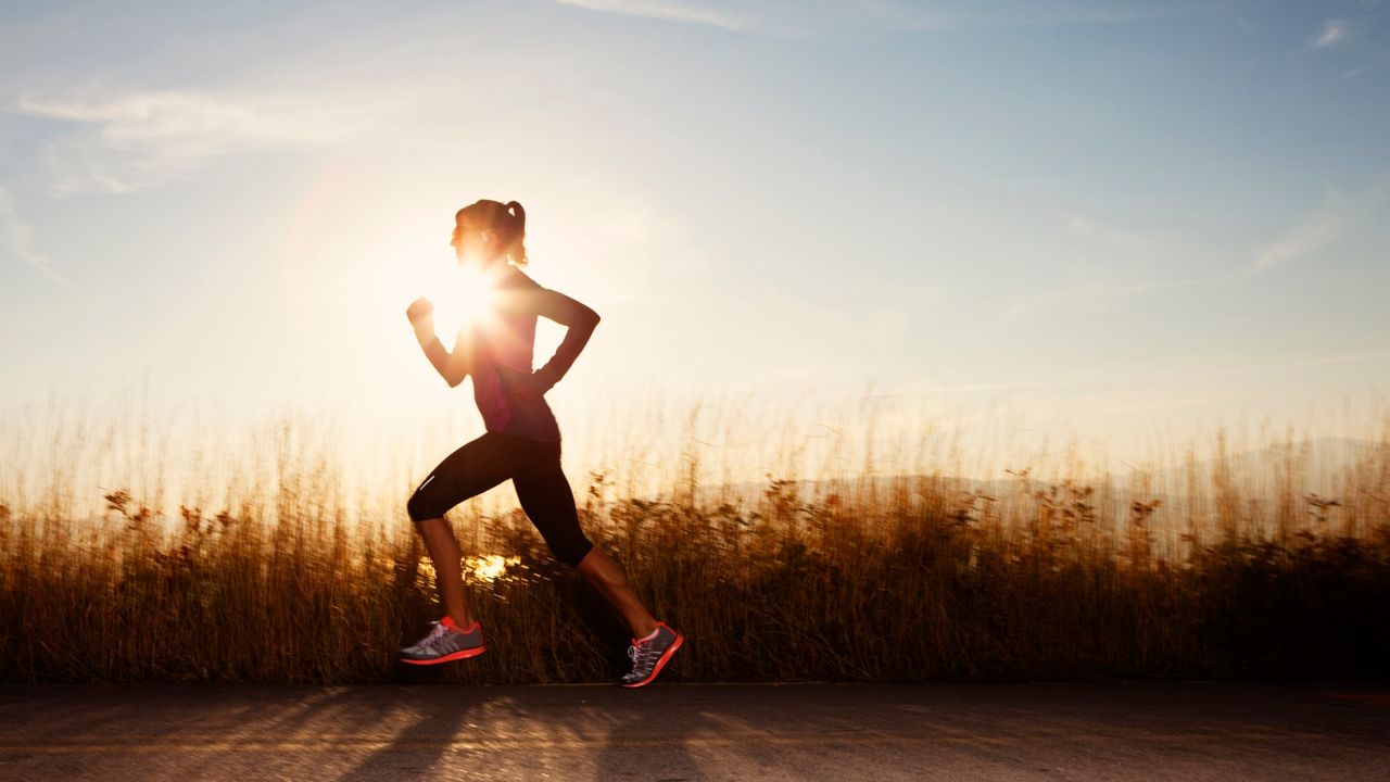 woman running along roadside