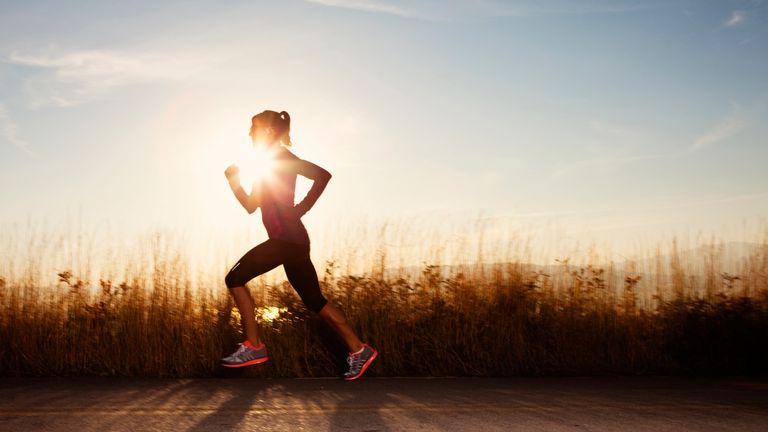 woman running along roadside