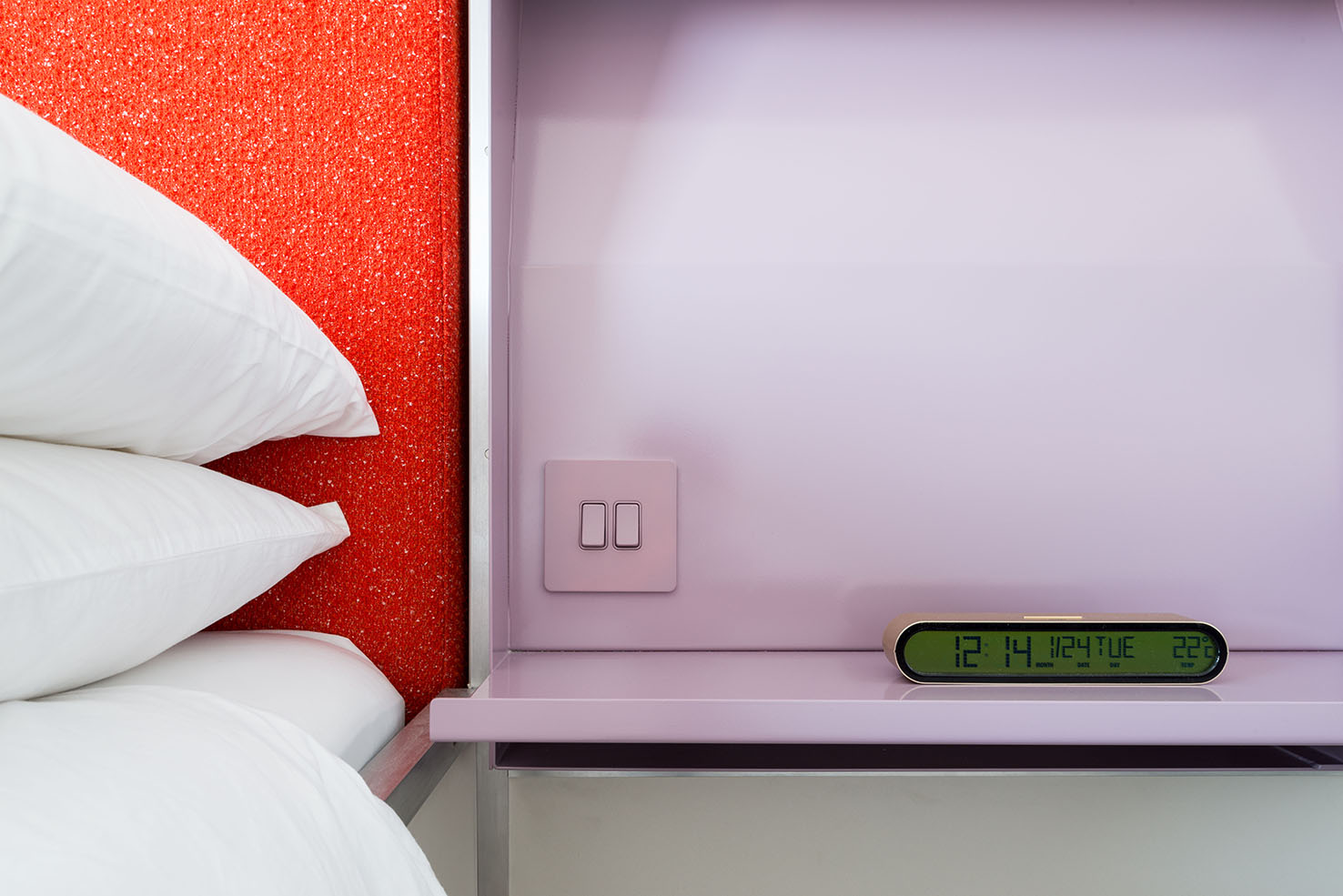 bedside table with purple and red colours