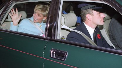 Princess Diana wearing a blue suit waving from a green car as her chauffeur drives her