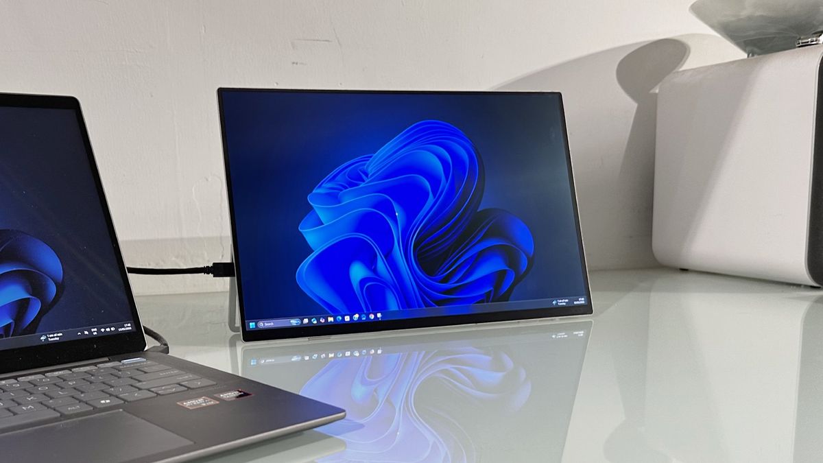 Testing the Acer ProDesigner PE160WUT in a home office next to a MacBook