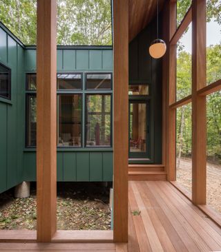 Timber walkway inside Forest Retreat by Scalar Architecture