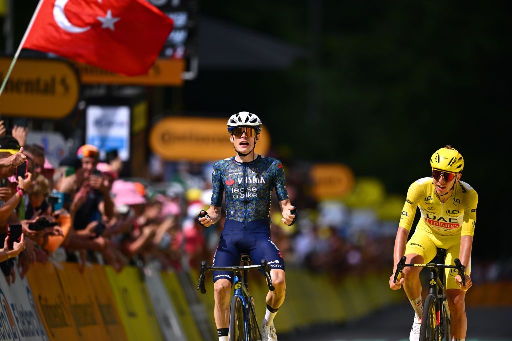 LELIORAN FRANCE JULY 10 LR Jonas Vingegaard Hansen of Denmark and Team Visma Lease a Bike celebrates at finish line as stage winner ahead of Tadej Pogacar of Slovenia and UAE Team Emirates Yellow Leader Jersey during the 111th Tour de France 2024 Stage 11 a 211km stage from EvauxlesBains to Le Lioran 1239m UCIWT on July 10 2024 in Le Lioran France Photo by Dario BelingheriGetty Images