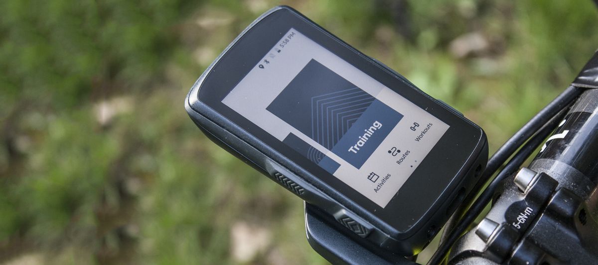 A Hammerhead Karoo 2 computer mounted to the front of a bike, with the training screen showing