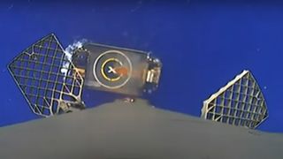 A SpaceX Falcon 9 rocket first-stage booster nears its landing droneship Just Read The Instructions after successfully launch two SES 03b mPower satellites into orbit from Florida on April 28, 2023.