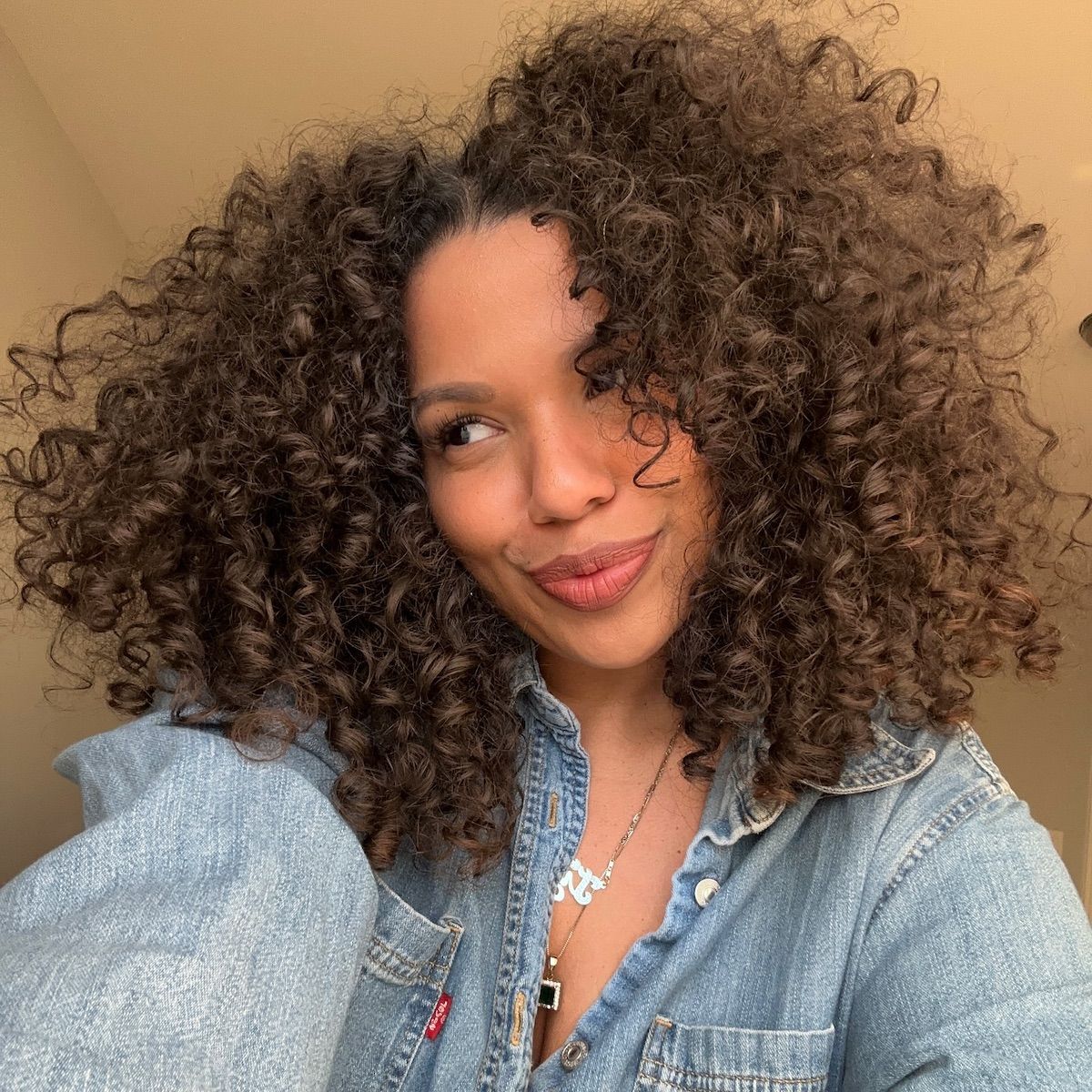 Content creator Ty Lauren bouncy, curly hair