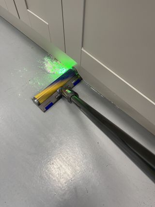 Dyson V12 Detect Slim vacuuming flour and sugar on hard floor