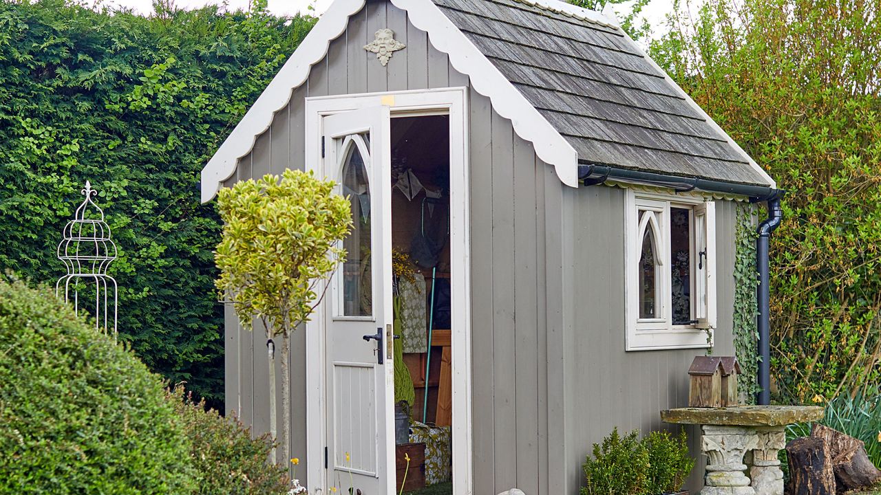 Exterior of grey panelled shed in garden