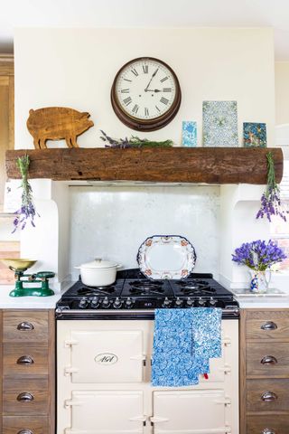 aga in a kitchen with wooden mantlepiece