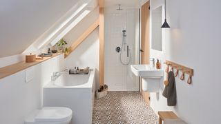 attic bathroom with bath under sloped ceilings space