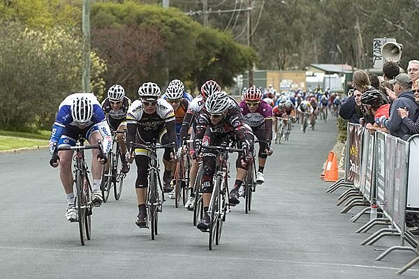Joel Pearson (left) of the Credit Collect-Prime Estate team holds on in the charge for third place in the stage.