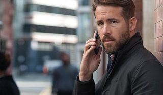 The Hitman's Bodyguard Ryan Reynolds having an outdoor phone call