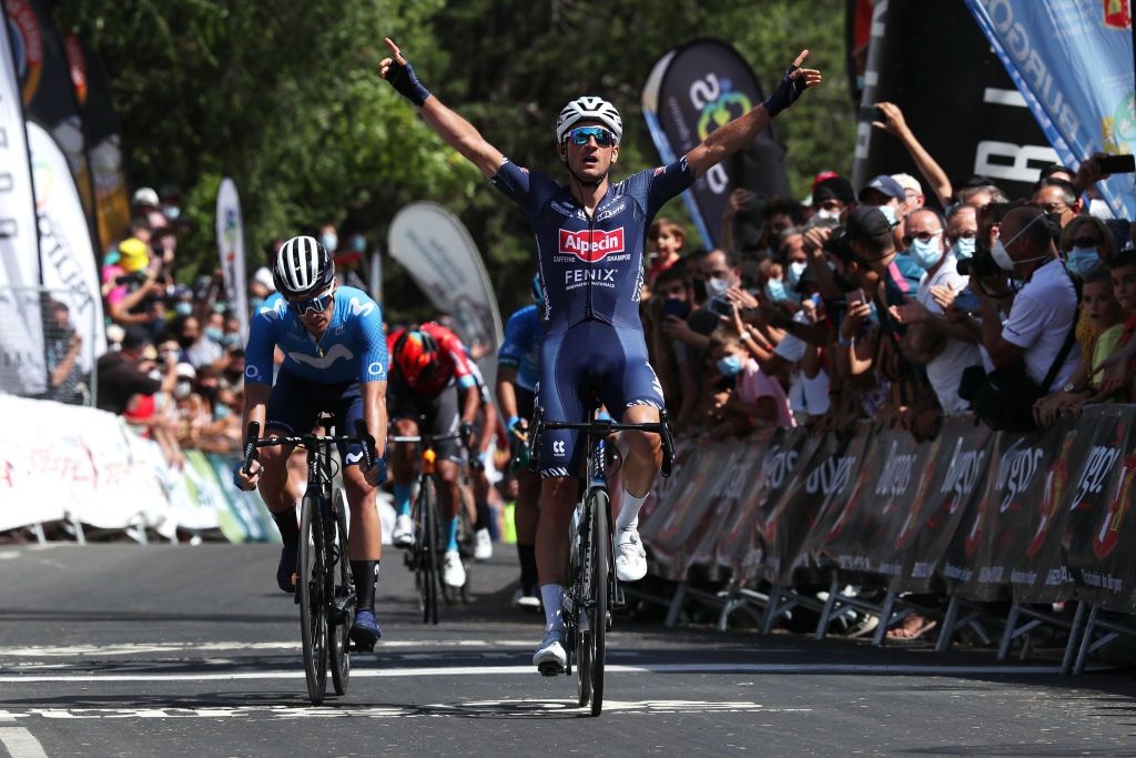 BURGOS SPAIN AUGUST 03 Planckaert Edward of Belgium and Team AlpecinFenix celebrates at finish line as stage winner ahead of Gonzalo Serrano of Spain and Movistar Team during the 43rd Vuelta a Burgos 2021 Stage 1 a 161km stage from BurgosCatedral to BurgosAlto del Castillo 980m VueltaBurgos BurgosCycling CapitalMundialdelCiclismo catedral2021 on August 03 2021 in Burgos Spain Photo by Gonzalo Arroyo MorenoGetty Images