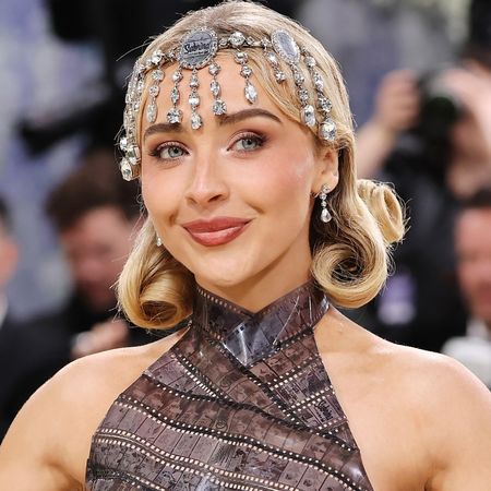 Sabrina Carpenter at the 2026 Met Gala in a dior red carpet dress