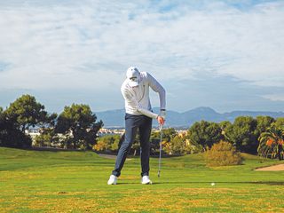 Golf Monthly Top 50 Coach Ben Emerson demonstrating how the chicken wing swing position can cause you to top the golf ball