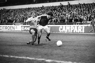 Nottingham Forest's John Robertson beats his marker in a game against Ajax in 1980.