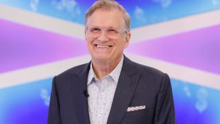 Drew Carey smiling on The Price Is Right show