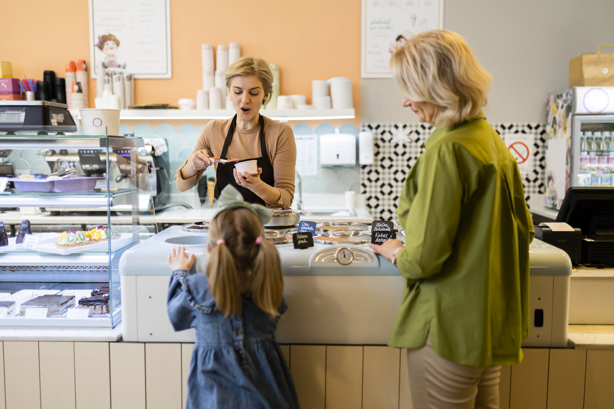 Woman buying her grandkid icec ream