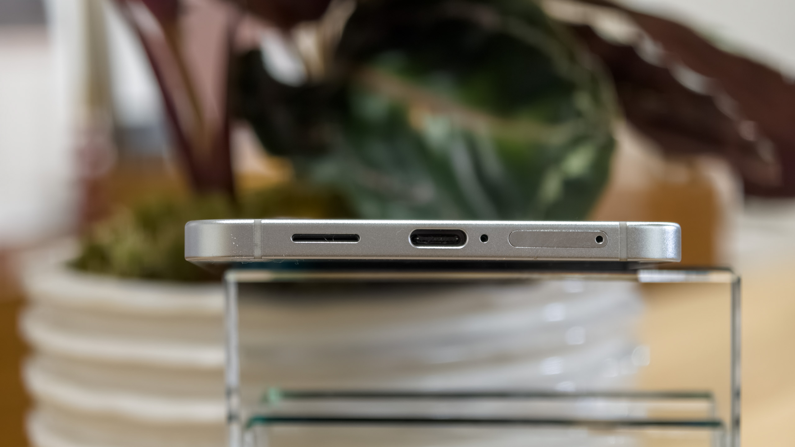 The Galaxy S25 Edge from the botton, showing the USB-C port, speaker grille, mic, and SIM tray