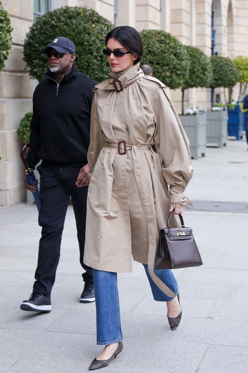 Kendall Jenner wearing a funnelneck coat outfit in Paris