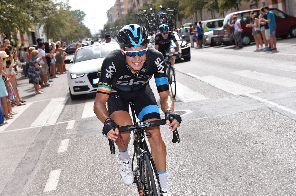 A bloodied Nico Roche (Team Sky) chases back into the peloton