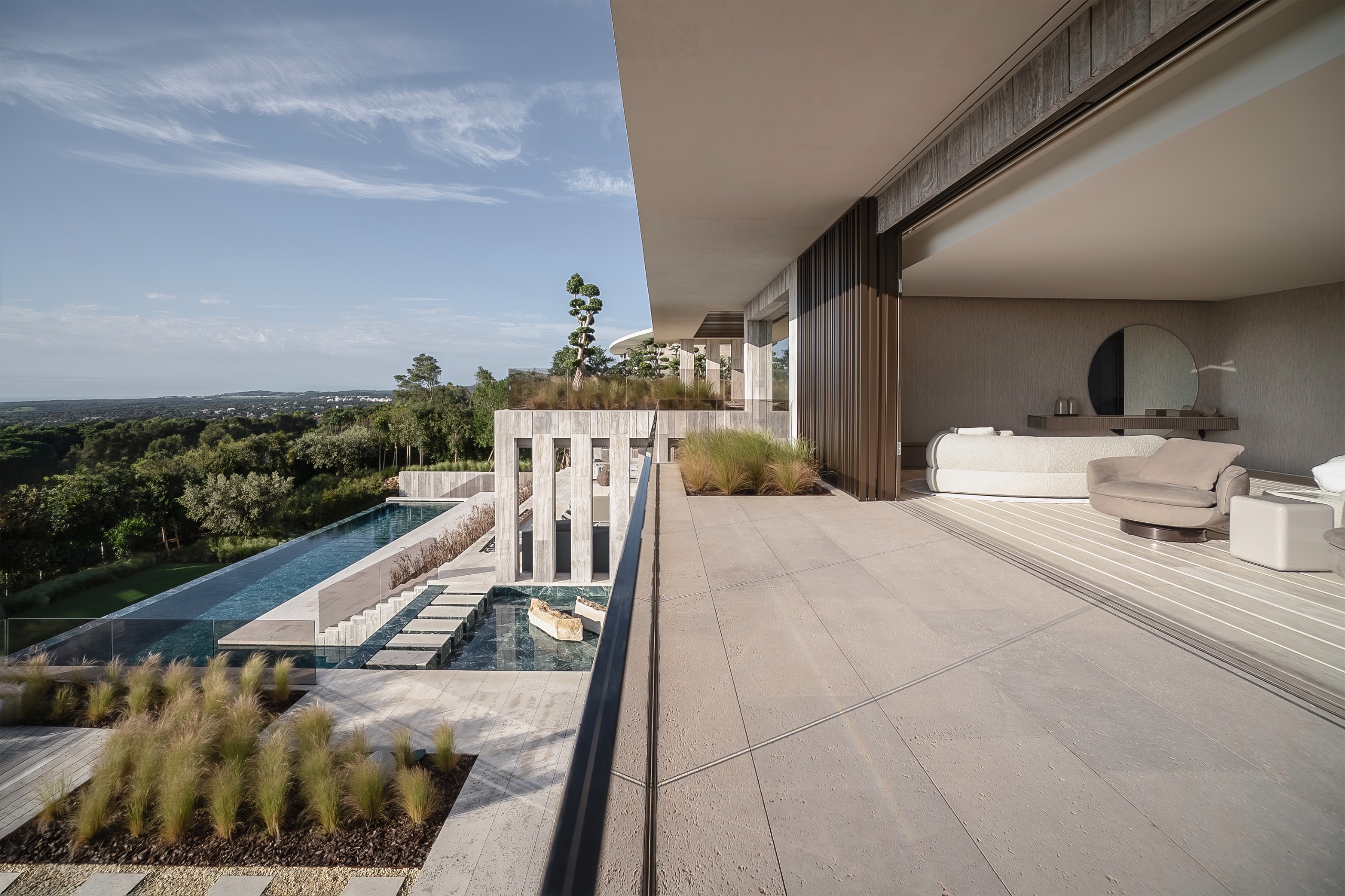 Villa ENSO by ARK Architects in Sotogrande, a luxurious villa with concrete and stone surfaces and swimming pools