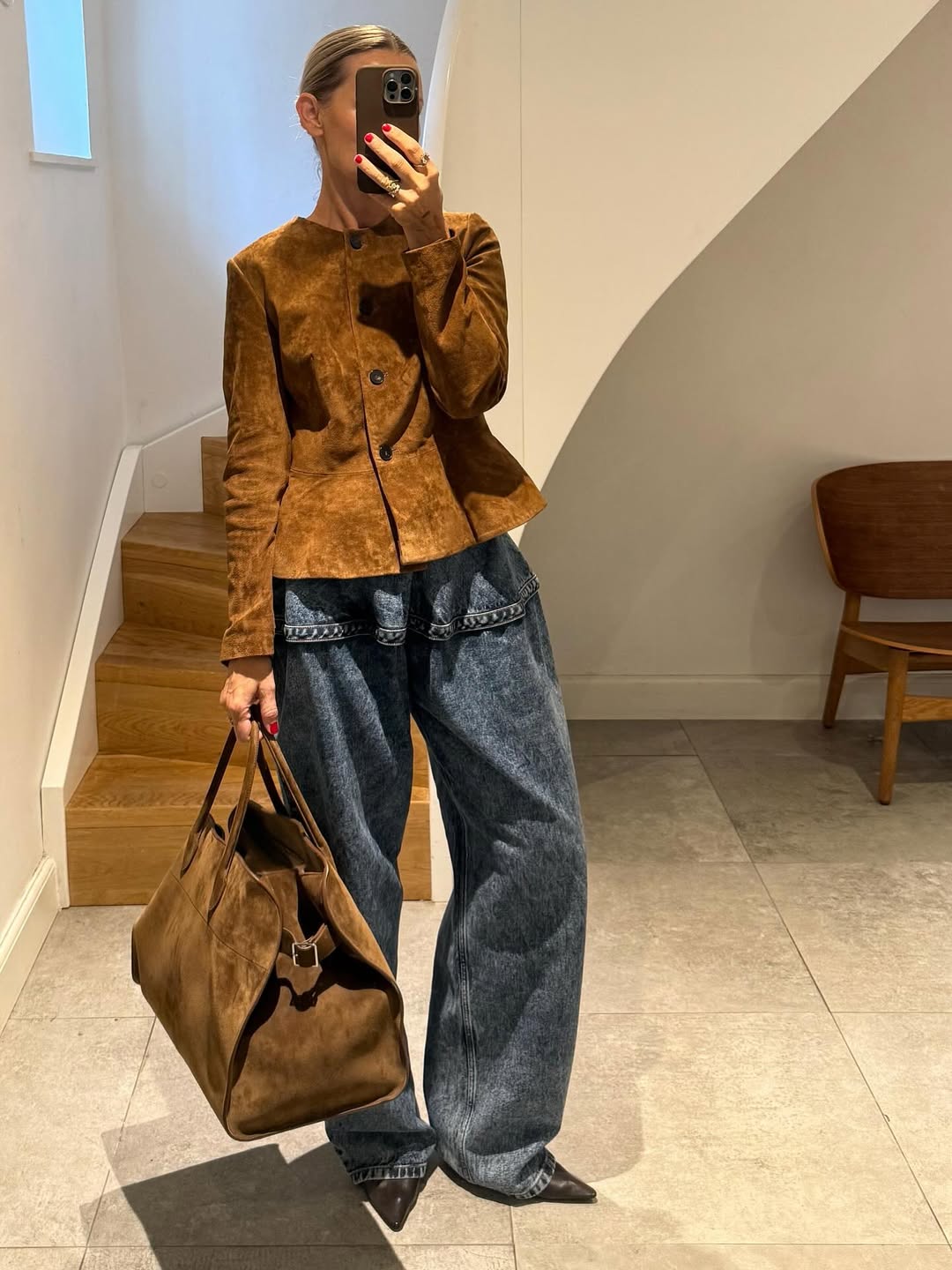Influencer wearing baggy jeans a suede jacket