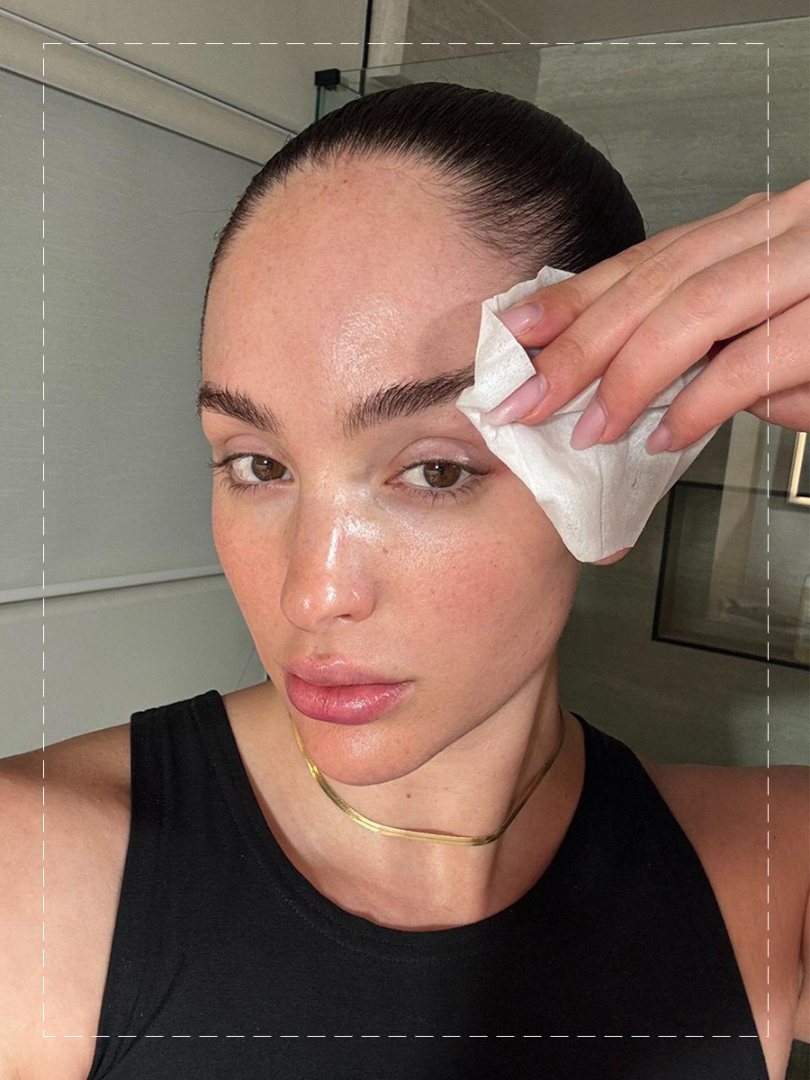 Ash K Holm using a dedicated eye cleanser