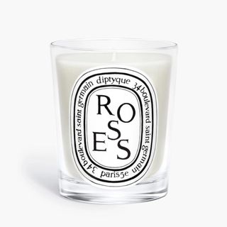 roses candle from diptique on a white background
