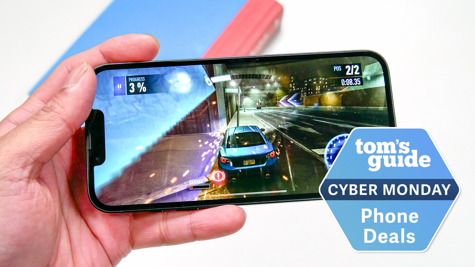 iPhone 16e Cyber held in hand with Cyber Monday badge nearby.