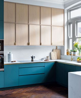 Kitchen with blue cabinets and wood cabinets