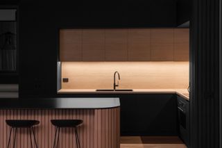 A kitchen with hidden lighting